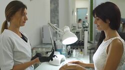 Charming girl in a manicure salon Stock Footage