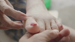 Senior Asian woman got Pain in feet finger joints , Gout Stock Footage