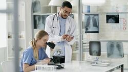 Multiethnic Doctors Performing Tests in Laboratory Stock Footage