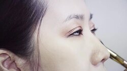 Professional make-up artist making up her model face Stock Footage