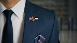 Businessman Walking Towards Camera With Friend Country Flags Pin United Kingdom - Western Sahara Stock Footage