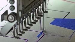 Automatic modern sewing machine embroider a pattern,Industrial embroidery equipment. Textile Manufacturers.Industrial textile factory,Textile Factory. Textile Industry. Stock Footage