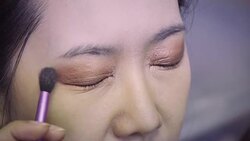 Professional make-up artist making up her model face Stock Footage