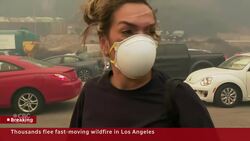 People fleeing L.A. wildfire abandon their cars to escape on foot News Clip
