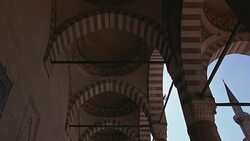 UP ANGLE OF STRIPED POINTED ARCHES AND CEILING. COULD BE SULEYMANIYE MOSQUE. ISLAMIC ARCHITECTURE. Stock Footage