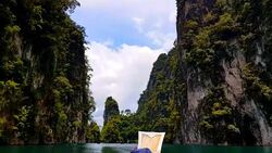 Moving follow boat with Beautiful mountains lake river sky and natural attractions in Ratchaprapha Dam at Khao Sok National Park, Surat Thani Province, Thailand. Stock Footage
