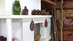 Traditional interior of the old Slavic house. Traditional Russian stove with utensils in a wooden log hut. Stock Footage