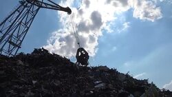 Scrap metal recycling plant and crane Stock Footage