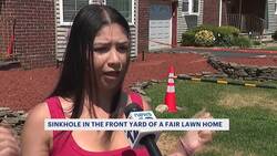 Toddler nearly falls into large sinkhole that formed in front yard of Fair Lawn home News Clip
