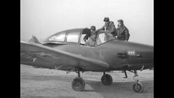 Pilot climbs into plane during the Korean War News Clip