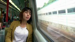 Young beautiful woman traveling by train Stock Footage