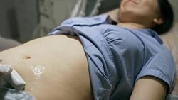 Doctor Screening Stomach of Asian Woman Stock Footage