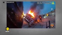Arizona: Police officer saves woman from burning car News Clip